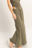 Person wearing a green ribbed outfit with wide-leg pants on a white background