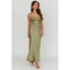Woman wearing a green strapless dress on a white background