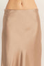 Beige satin slip skirt on a plain background