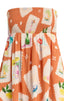 Orange strapless dress with colorful pattern on a plain background