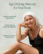 Woman with white hair sitting on a chair with text about age-defying skincare.