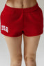 Red shorts with 'USA' text on a plain background