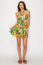 Woman wearing a colorful dress with a pattern on a white background