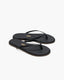 Black flip-flops with 'Kees' branding on a white background