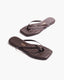 Pair of brown flip-flops with a textured pattern 