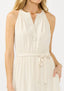 Woman wearing a white dress with a plain background