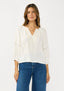 Woman wearing a white blouse and blue jeans on a white background
