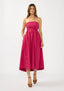Woman wearing a strapless pink dress on a white background