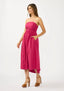 Woman wearing a strapless pink dress on a white background
