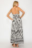 Woman wearing a zebra print dress on a white background