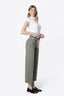 Four views of a model wearing wide-leg cropped pants in a muted sage green color, paired with a white sleeveless top, shown against a plain white background.