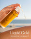 Hand holding a bottle of OSEA liquid oil with a blurred beach background