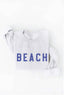White t-shirt with 'BEACH' printed in blue on a white background