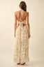 Woman wearing a long, patterned dress with an open back on a beige background