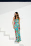 Woman wearing a colorful floral dress on a white background