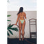 Woman in a colorful bikini standing with a hose against a white wall.