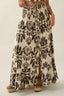 Long floral skirt with a pattern on a plain background