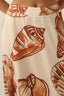 Skirt with shell pattern on a beige background