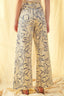Floral-patterned pants worn by a person on a light background