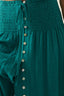 Teal dress with button details on a plain background