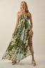 Woman wearing a floral dress with a neutral background