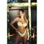 Woman in a yellow bikini standing in front of a mirror.