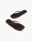 Black flip-flops with tan soles 
