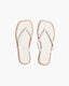 Pair of white flip-flops with beige soles 