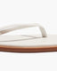 Pair of white flip-flops with beige soles 