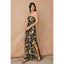 Woman wearing a strapless floral dress with a slit on a beige background