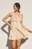 Woman wearing a floral dress against a white background
