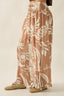Floral patterned pants on a plain background