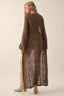 Woman wearing a long brown patterned dress on a beige background