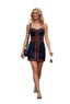 A woman walking down a cobblestone street wearing a navy blue mini dress with orange and beige geometric trim, carrying a small navy handbag.