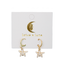Star-shaped earrings on a 'lotus & luna' branded card