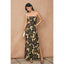 Woman wearing a strapless floral dress against a beige background