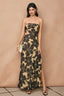 Woman wearing a strapless floral dress against a beige background