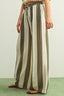 Striped pants worn by a person on a plain background
