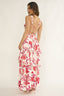 Woman wearing a floral dress with a white background