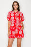 Woman wearing a red set with white patterns on a white background