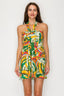 Woman wearing a colorful floral dress on a white background