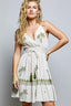White boho a-line mini dress with green palm tree detailing 