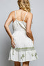 White boho a-line mini dress with green palm tree detailing 